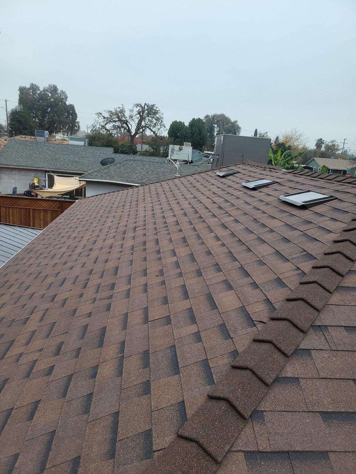 Completed brown architectural-shingle roof
